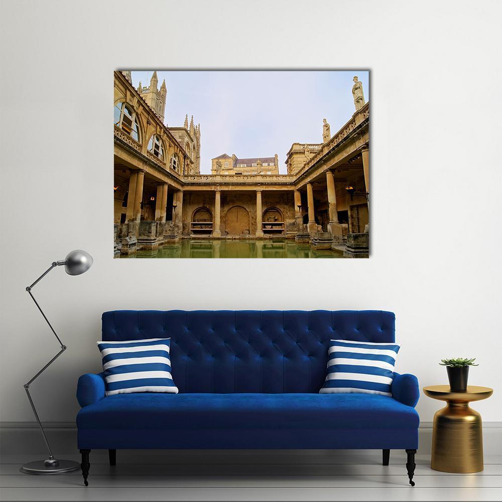 Serene Roman Baths with Gothic Arches Canvas Wall Art in beige, brown and blue, single panel hung on a wall