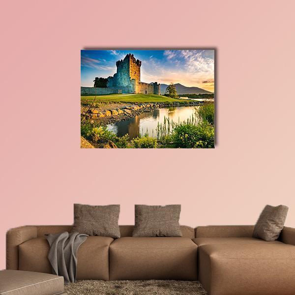 Ross Castle at Sunset Canvas Wall Art in yellow, green and blue, single panel hung on a wall