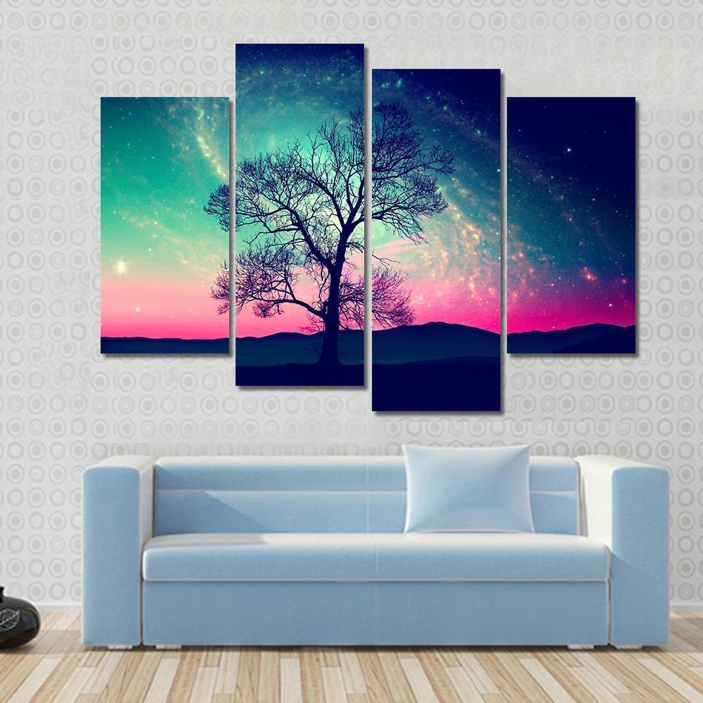 Andromeda Galaxy Over Earth Canvas Wall Art in blue, purple and pink, 4 panel Pop layout hung on a wall