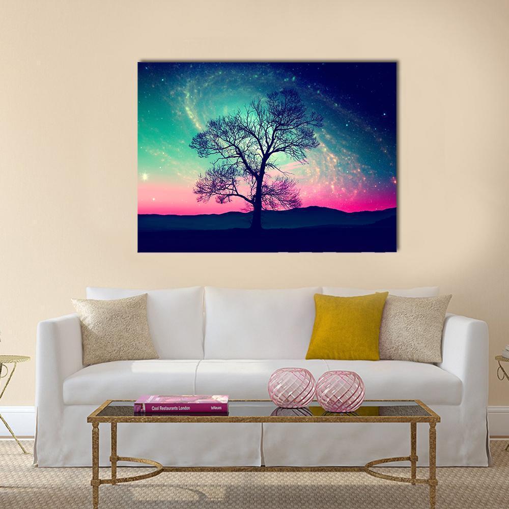 Andromeda Galaxy Over Earth Canvas Wall Art in blue, purple and pink, single panel hung on a wall
