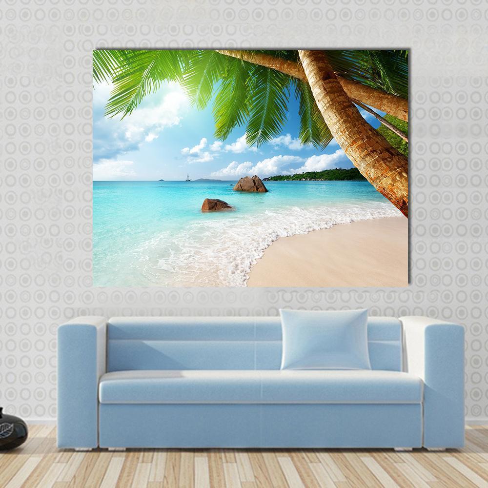Anse Lazio Beach Seychelles Canvas Wall Art in beige, green and blue, single panel hung on a wall