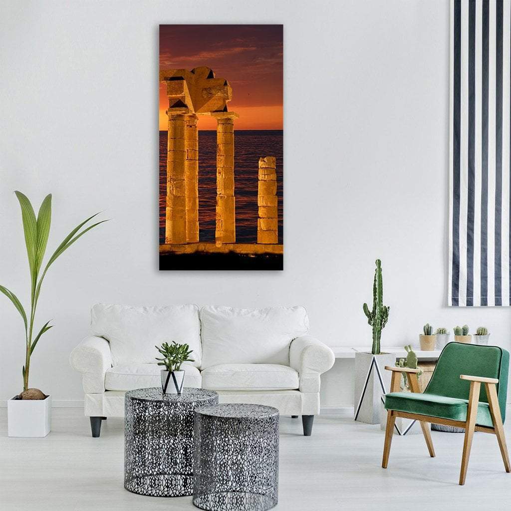 Apollo Temple at Sunset Vertical Canvas Wall Art in black, gold and orange, single vertical panel hung on a wall
