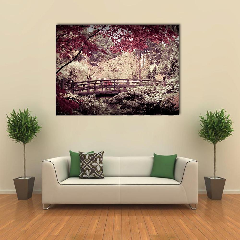 Arched Bridge in Japanese Garden Canvas Wall Art in brown, red and pink, single panel hung on a wall
