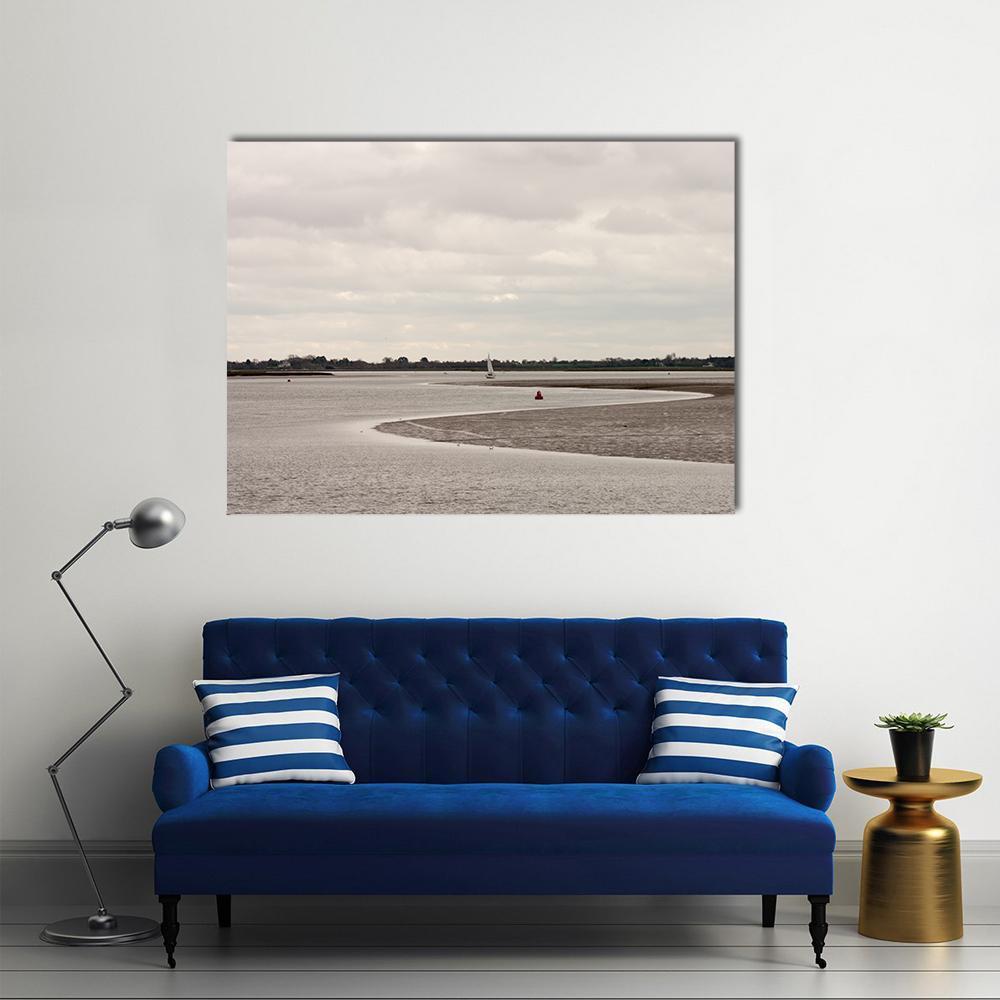 Riverbend with White Sailboat and Mudflats Canvas Wall Art in gray, beige and brown, single panel hung on a wall