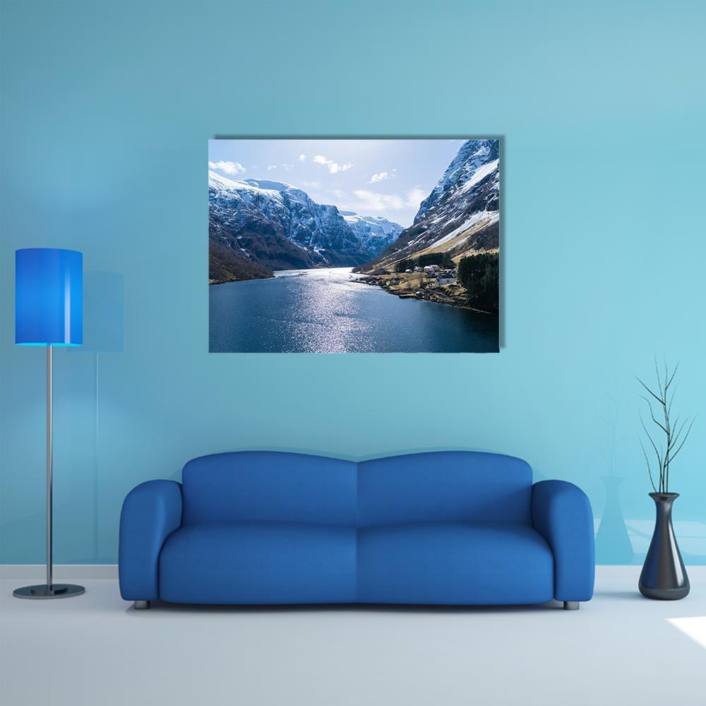 Ardal Fjord Village in Winter Canvas Wall Art in white, gray and blue, single panel hung on a wall