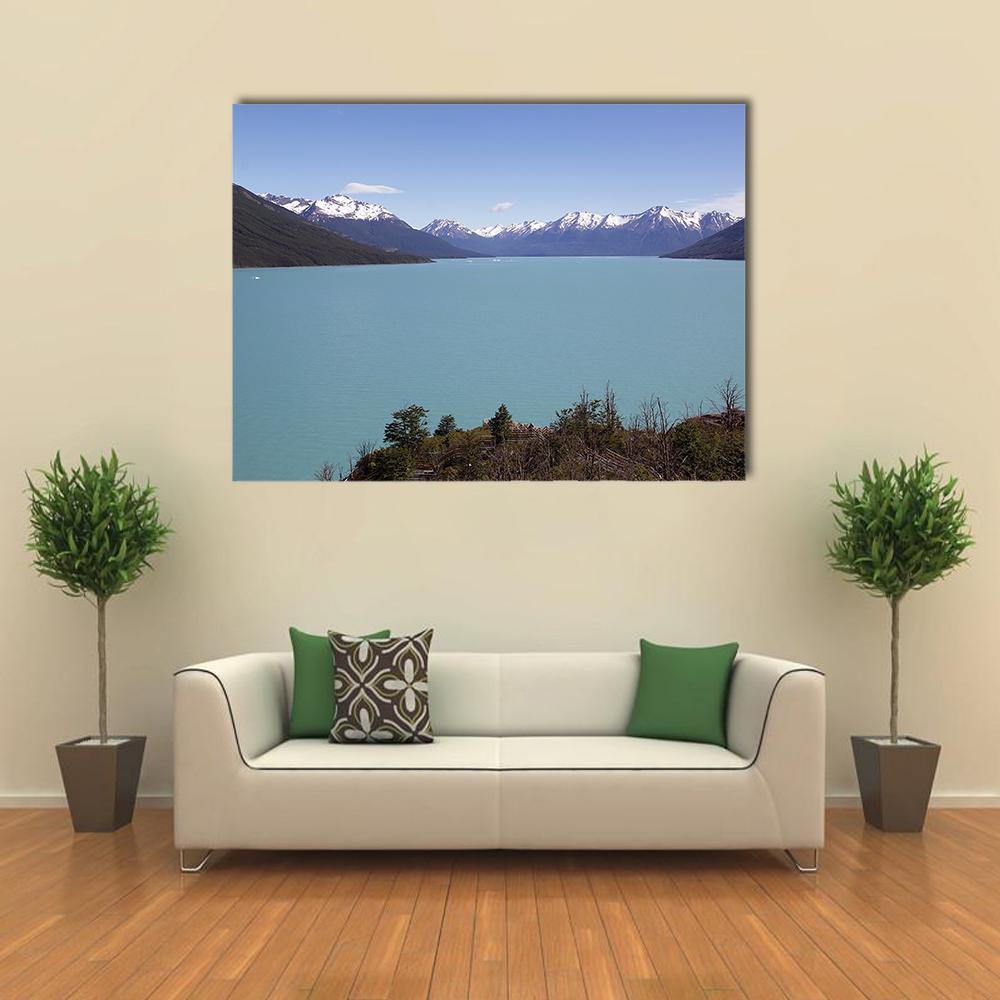 Argentino Lake Landscape Canvas Wall Art in white, gray and blue, single panel hung on a wall