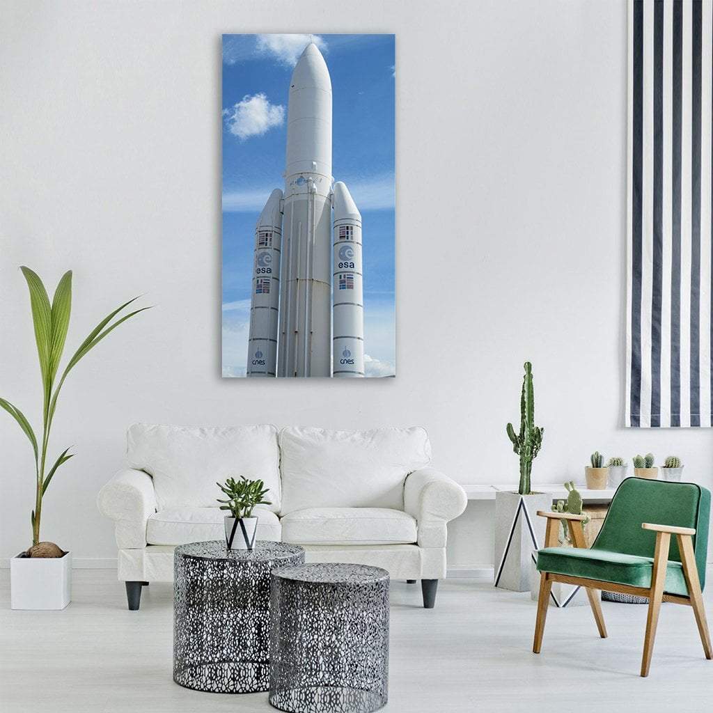 Ariane Rocket Launch Vertical Canvas Wall Art in white, gray and blue, single vertical panel hung on a wall