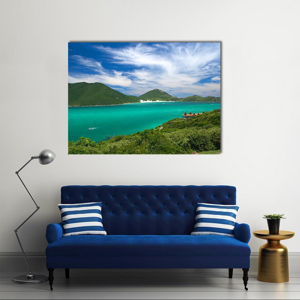 Turquoise Bay with Orange-roofed Buildings Canvas Wall Art in green and blue, single panel hung on a wall