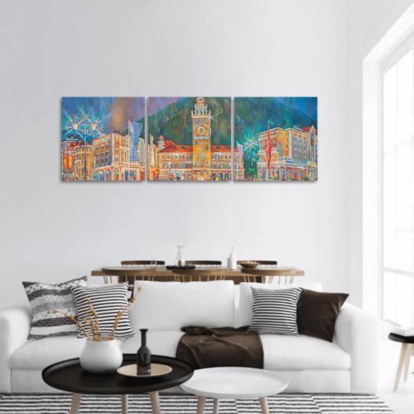 Night Festival Clock Tower Cityscape Panoramic Canvas Wall Art in orange, yellow and blue, hung on a wall