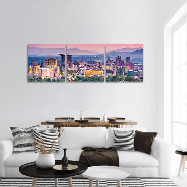Asheville Skyline at Dusk Panoramic Canvas Wall Art in blue, purple and pink, hung on a wall