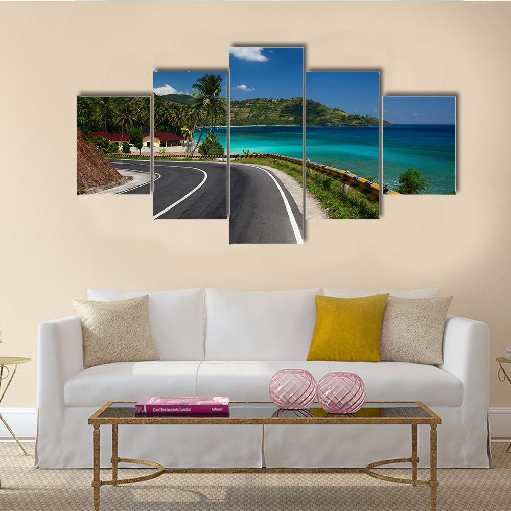 Tropical Coastal Road with Palm Trees Canvas Wall Art in gray, green and blue, 5 panel Star layout hung on a wall
