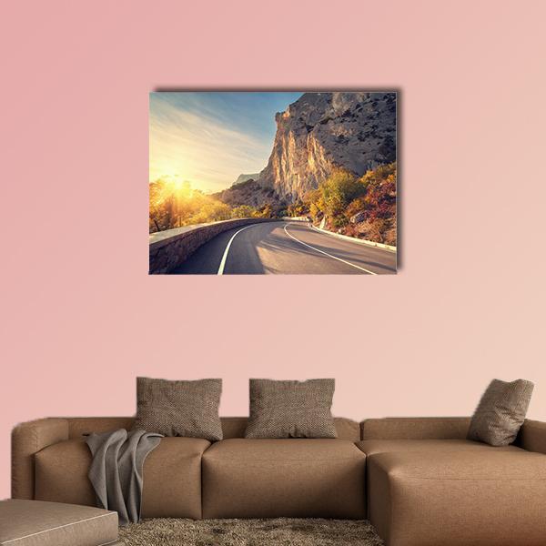 Curving Mountain Road in Autumn Sun Canvas Wall Art in gray, brown and yellow, single panel hung on a wall