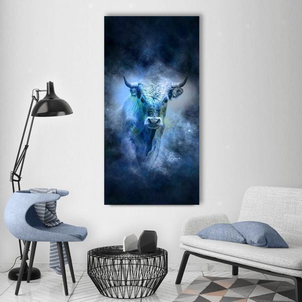 Cosmic Taurus Bull Vertical Canvas Wall Art in black, blue and navy, single vertical panel hung on a wall