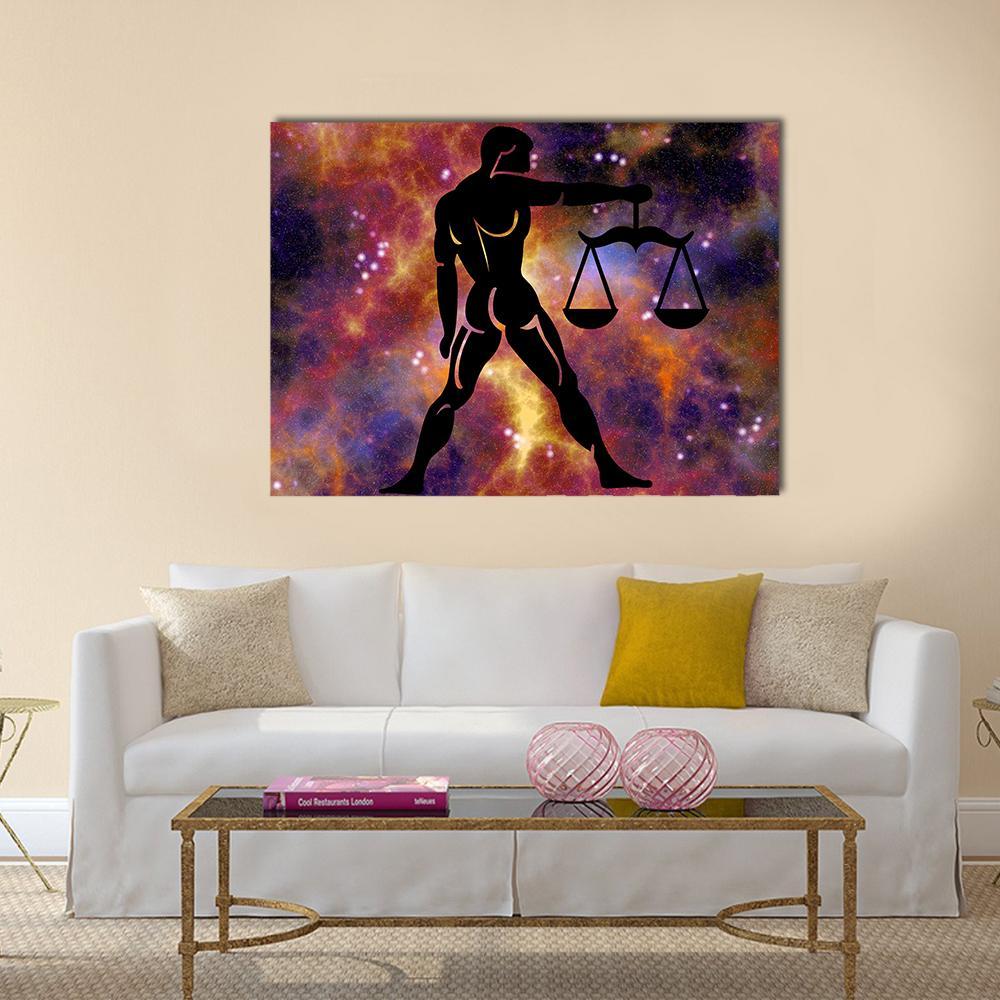 Libra Zodiac Silhouette with Scales Canvas Wall Art in black, orange and purple, single panel hung on a wall