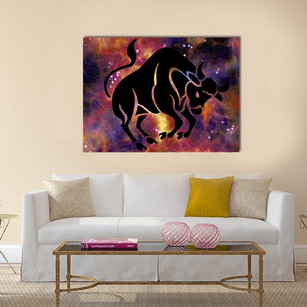 Taurus Bull in Nebula Canvas Wall Art in black, orange and purple, single panel hung on a wall