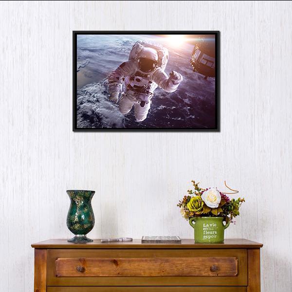 Astronaut Above The Earth Canvas Wall Art-1 Piece-Floating Frame-24" x 16"-Tiaracle