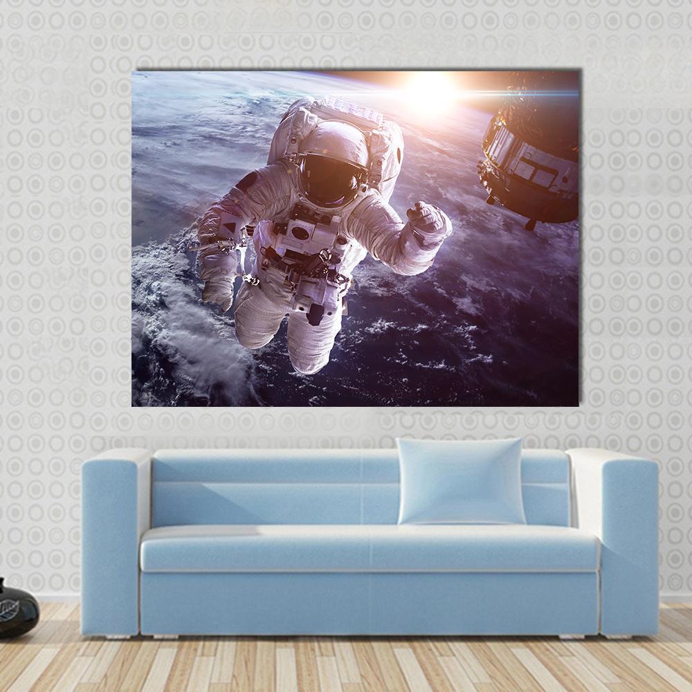 Astronaut Above The Earth Canvas Wall Art-1 Piece-Gallery Wrap-48" x 32"-Tiaracle