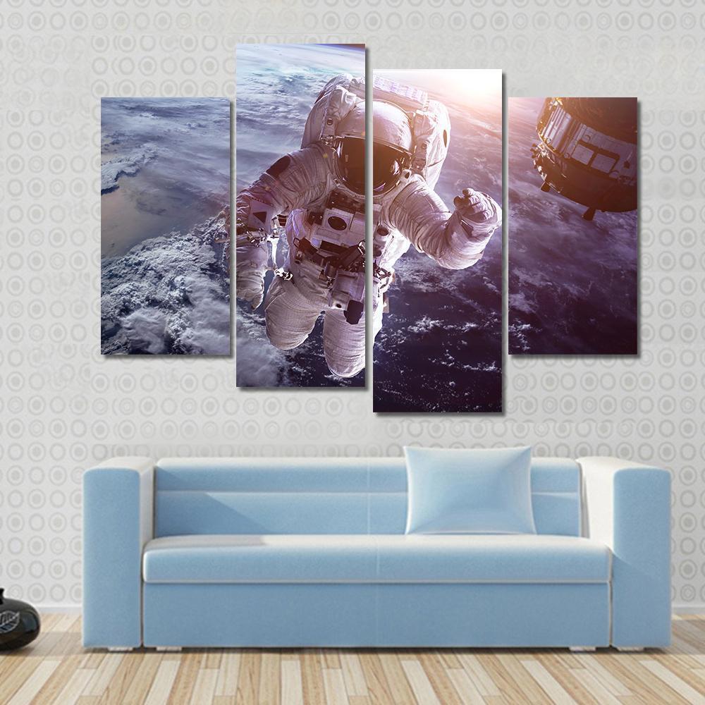 Astronaut Above The Earth Canvas Wall Art-4 Pop-Gallery Wrap-50" x 32"-Tiaracle