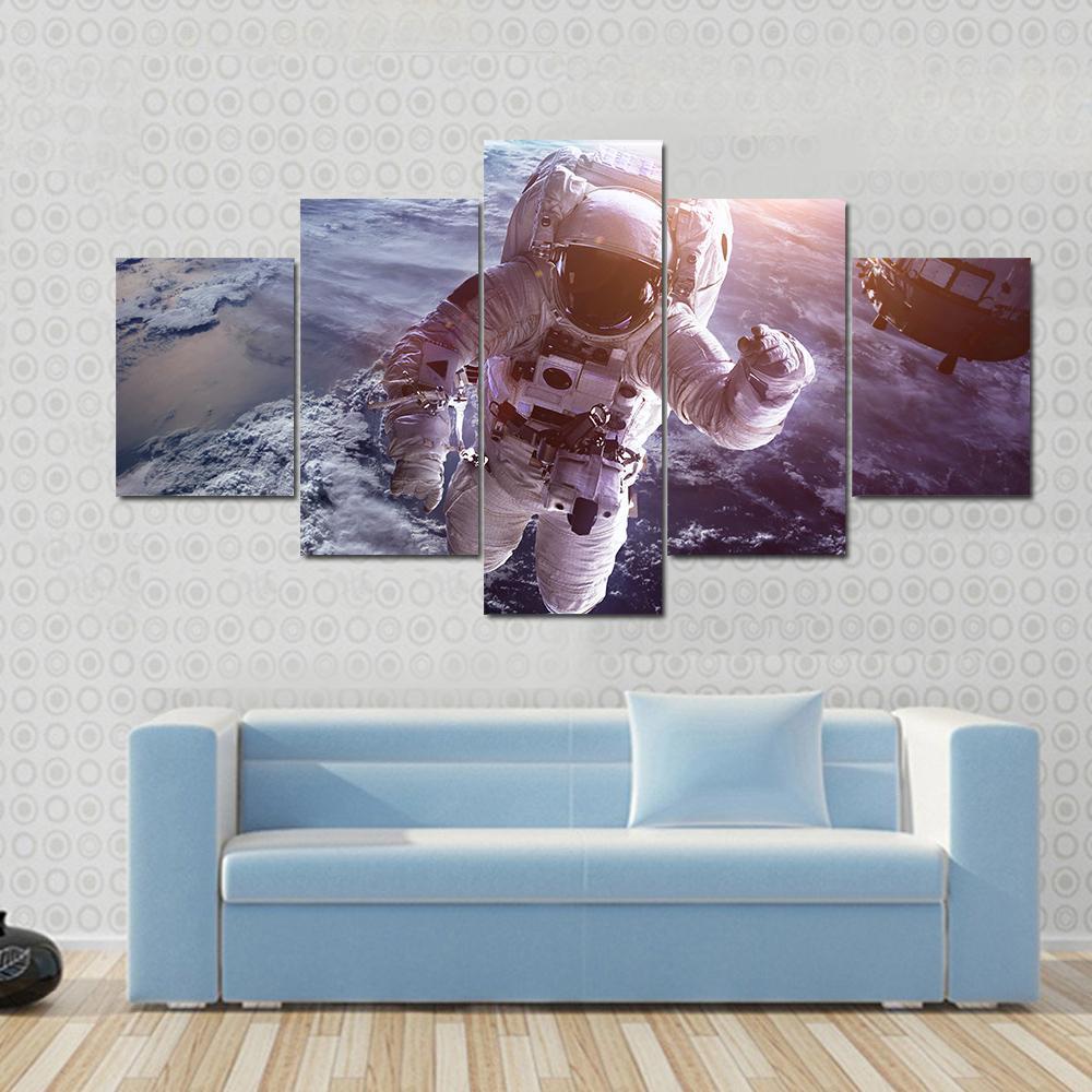 Astronaut Above The Earth Canvas Wall Art-5 Star-Gallery Wrap-62" x 32"-Tiaracle