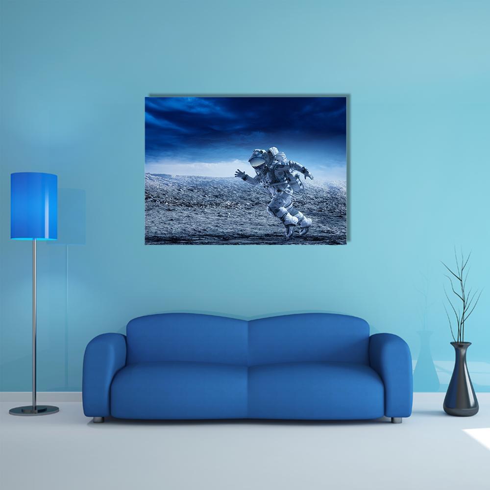 Astronaut Running on Lunar Surface Canvas Wall Art in white, gray and blue, single panel hung on a wall