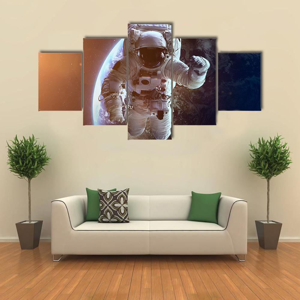 Astronaut Near Planet Earth Canvas Wall Art-5 Star-Gallery Wrap-62" x 32"-Tiaracle