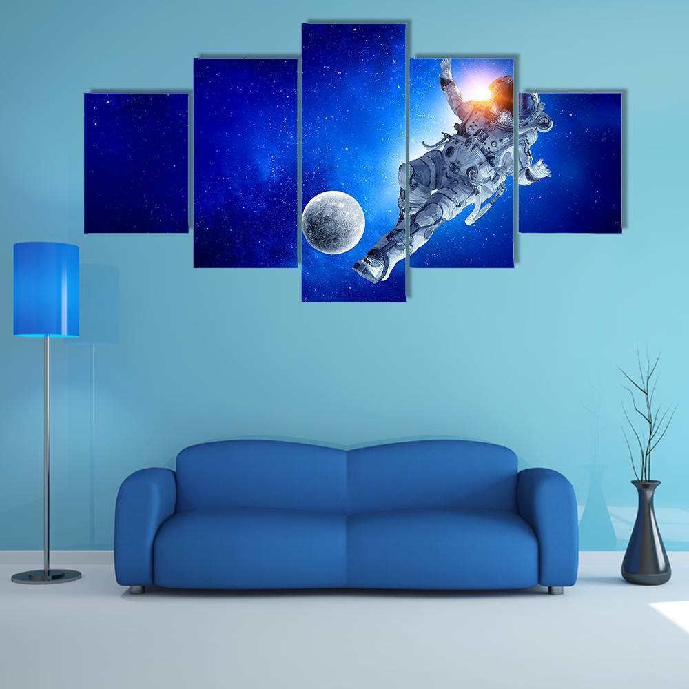 Astronaut Play Soccer Game Canvas Wall Art-5 Star-Gallery Wrap-62" x 32"-Tiaracle