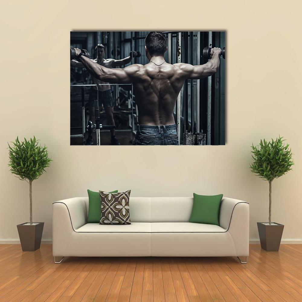 Athlete in Old Rusty Gym with Dumbbells Canvas Wall Art in black and gray, single panel hung on a wall