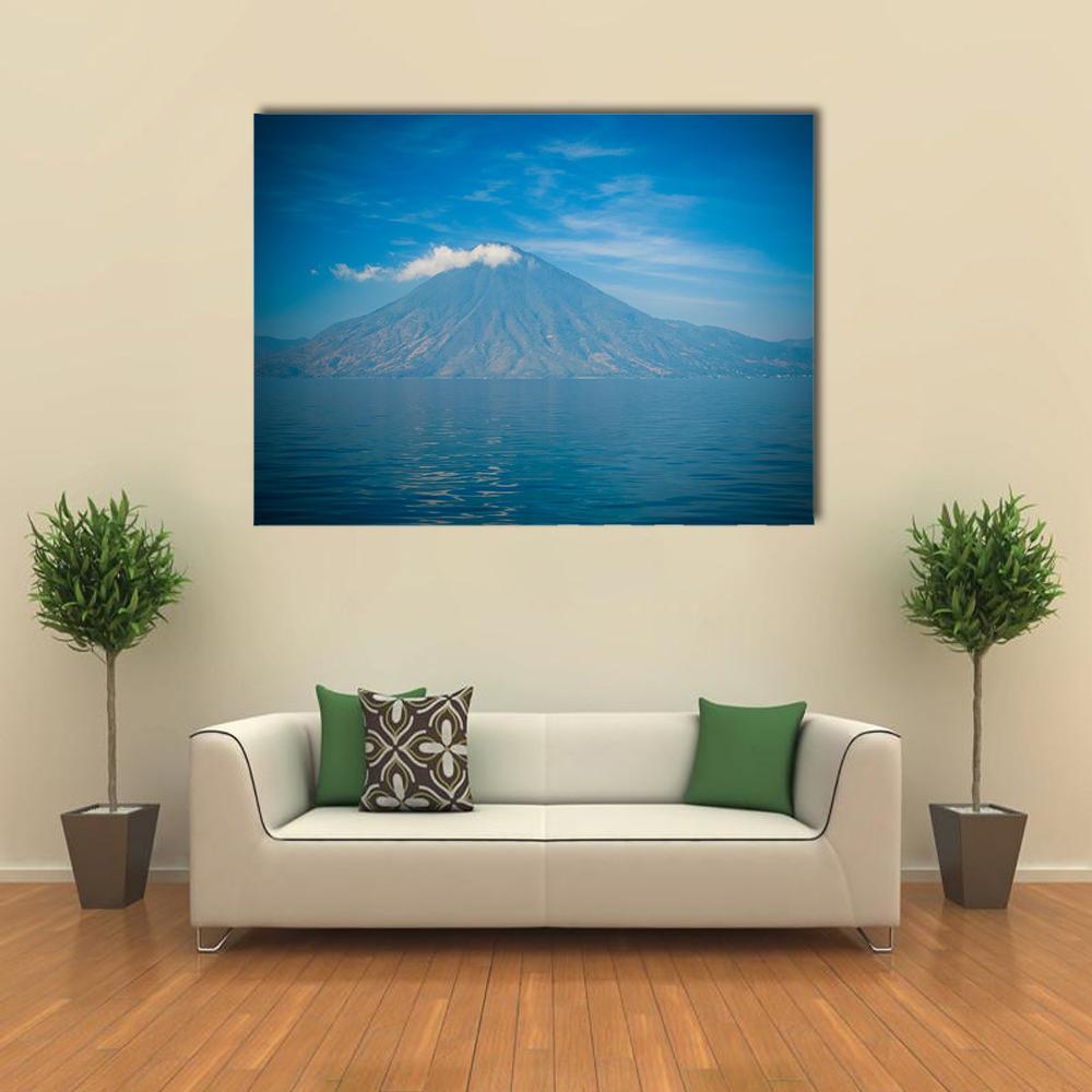 Atitlan Volcano and Lake Canvas Wall Art in gray and blue, single panel hung on a wall