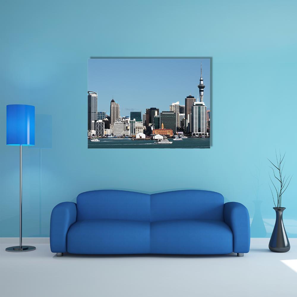 City Skyline with Sky Tower Canvas Wall Art in white, gray and blue, single panel hung on a wall