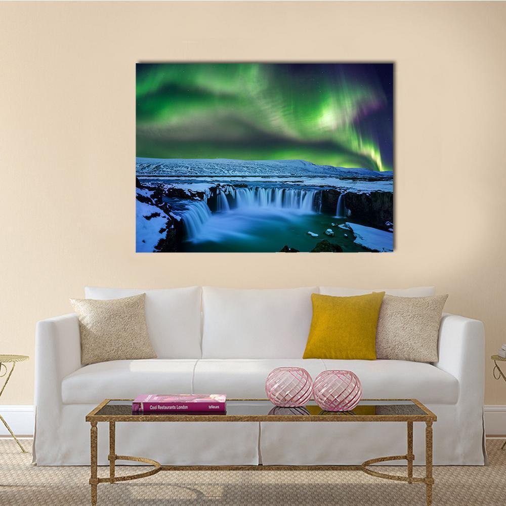 Aurora Over Godafoss Waterfall Canvas Wall Art in green and blue, 3 panel horizontal set hung on a wall