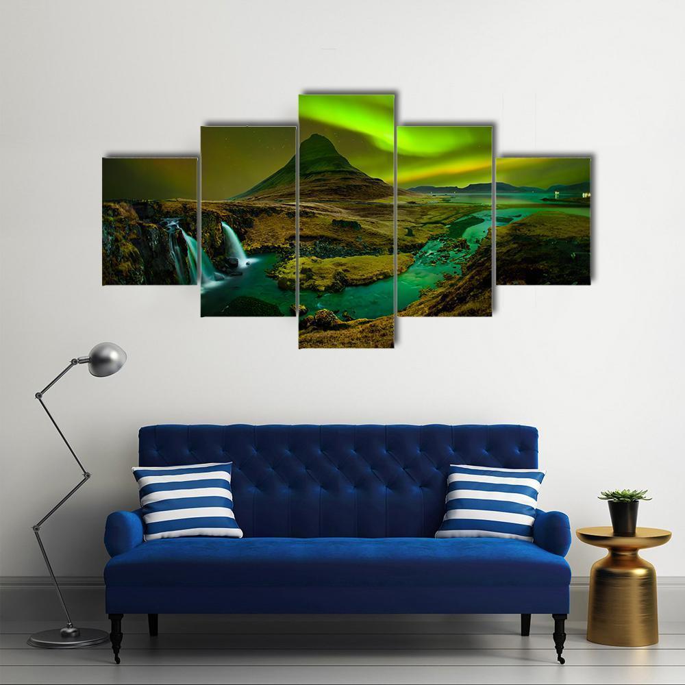 Aurora Over Kirkjufell Waterfall Canvas Wall Art in black, brown and green, 5 panel Star layout hung on a wall