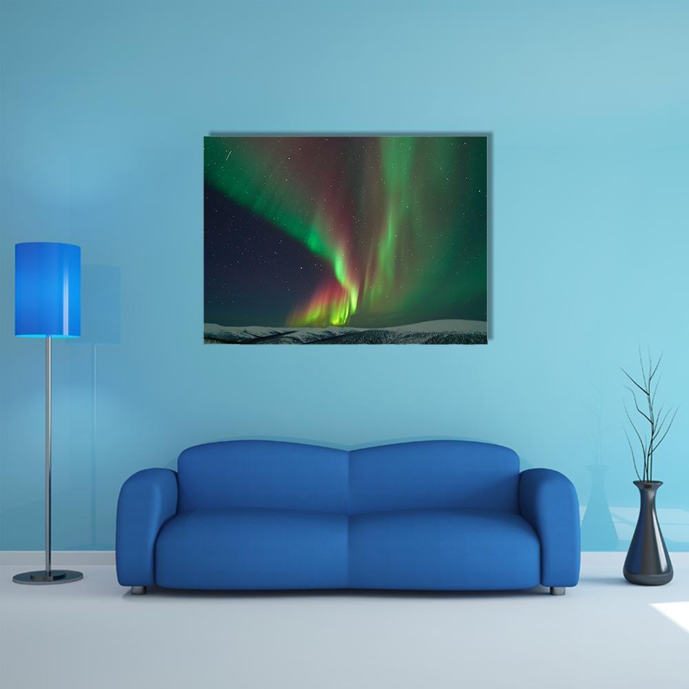 Aurora Borealis and Meteors Over Snowy Ridge Canvas Wall Art in black, green and purple, single panel hung on a wall