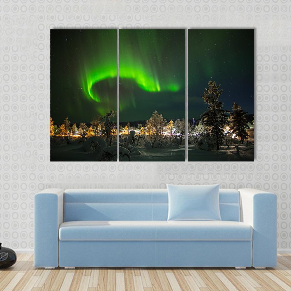 Aurora Borealis in Lapland Canvas Wall Art in black and green, 3 panel horizontal set hung on a wall