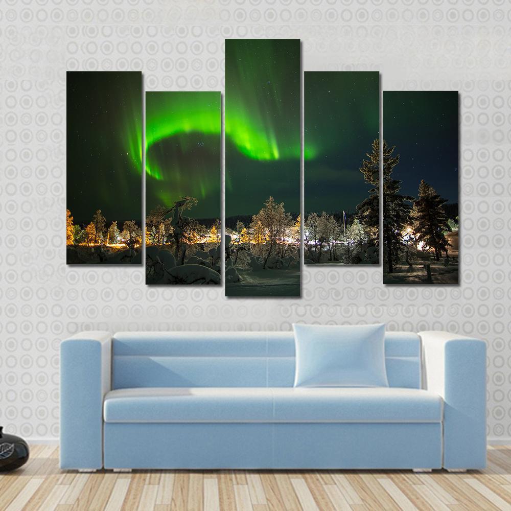 Aurora Borealis in Lapland Canvas Wall Art in black and green, 4 panel Pop layout hung on a wall