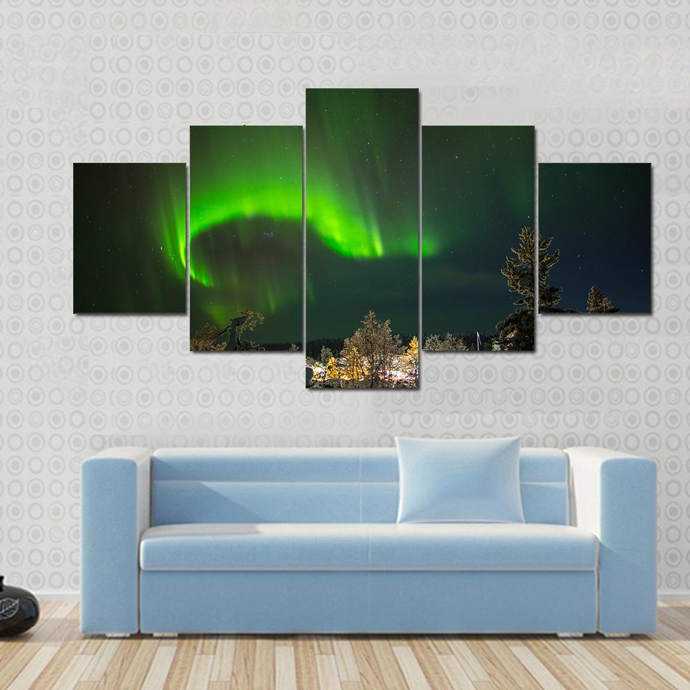 Aurora Borealis in Lapland Canvas Wall Art in black and green, 4 panel Pop layout hung on a wall