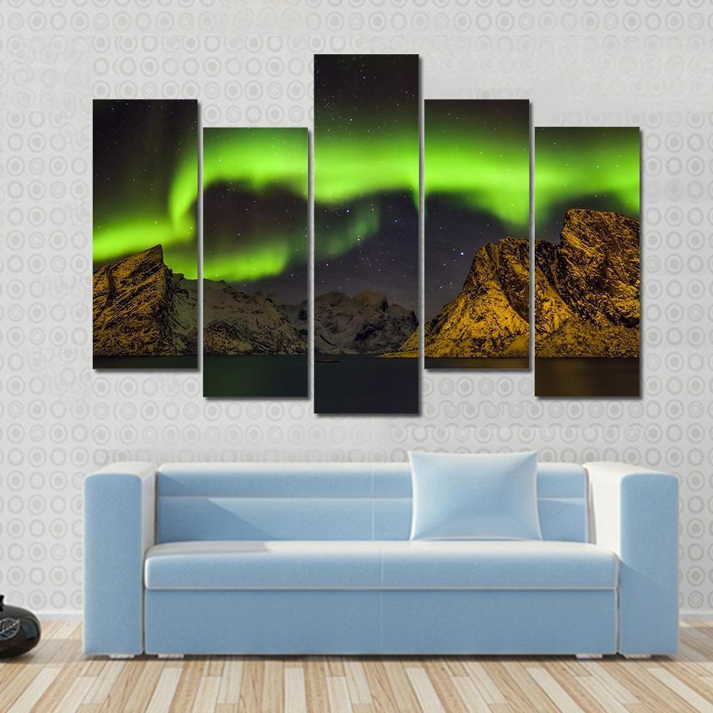 Aurora Borealis Lofoten Islands Canvas Wall Art in black, yellow and green, 3 panel horizontal set hung on a wall