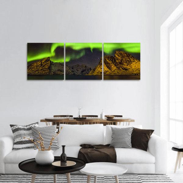 Aurora Over Lofoten Islands Panoramic Canvas Wall Art in black, yellow and green, single panel hung on a wall