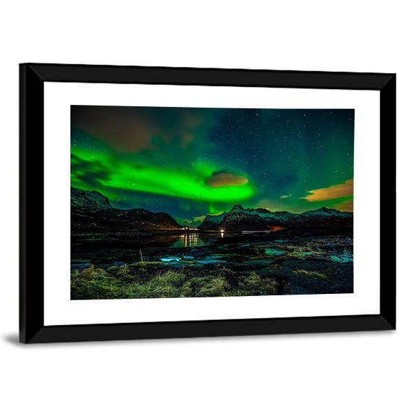 Aurora Borealis Over Mountains Canvas Wall Art in black, green and blue, 4 panel Pop layout hung on a wall