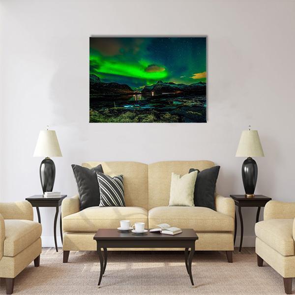 Aurora Borealis Over Mountains Canvas Wall Art in black, green and blue, 4 panel Pop layout hung on a wall