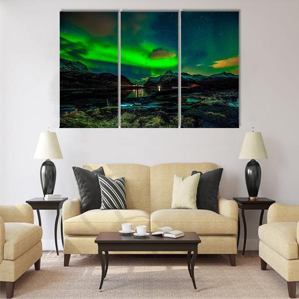 Aurora Borealis Over Mountains Canvas Wall Art in black, green and blue, 4 panel Pop layout hung on a wall