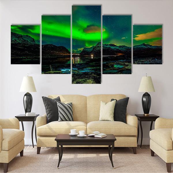 Aurora Borealis Over Mountains Canvas Wall Art in black, green and blue, 4 panel Pop layout hung on a wall