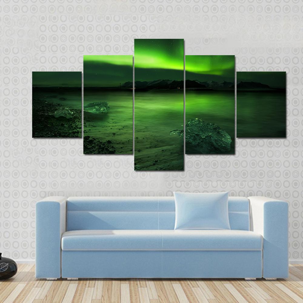Aurora Northern Lights Canvas Wall Art in black and green, 4 panel Pop layout hung on a wall