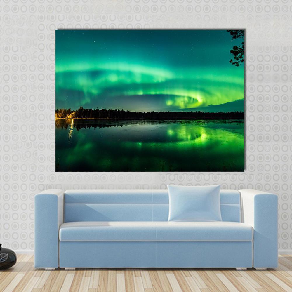 Aurora Over Finnish Lake Canvas Wall Art in black and green, 5 panel Star layout hung on a wall