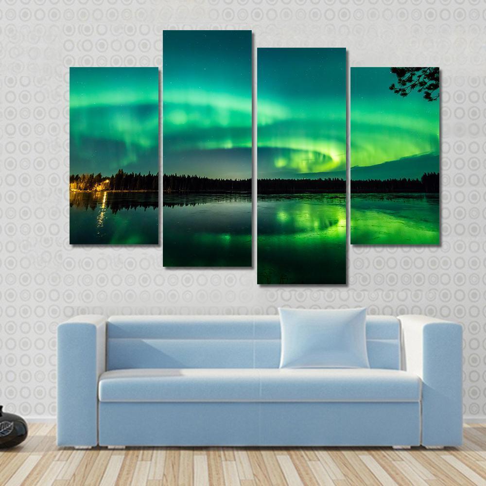 Aurora Over Finnish Lake Canvas Wall Art in black and green, 5 panel Star layout hung on a wall