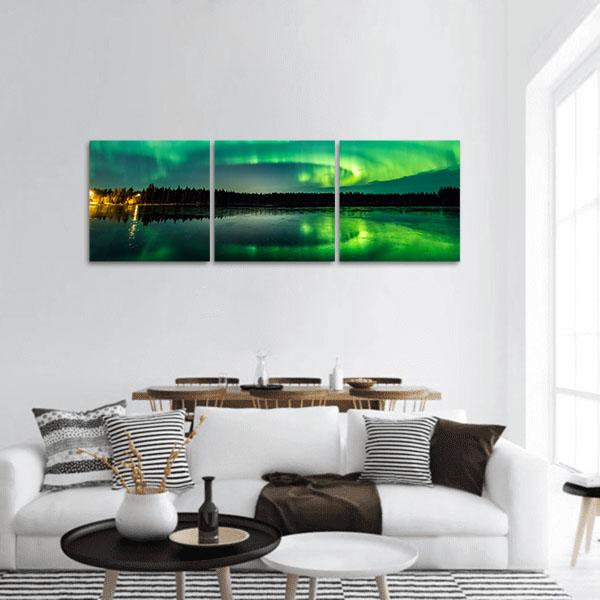 Aurora Over Finnish Lake Panoramic Canvas Wall Art in black and green, single panel hung on a wall