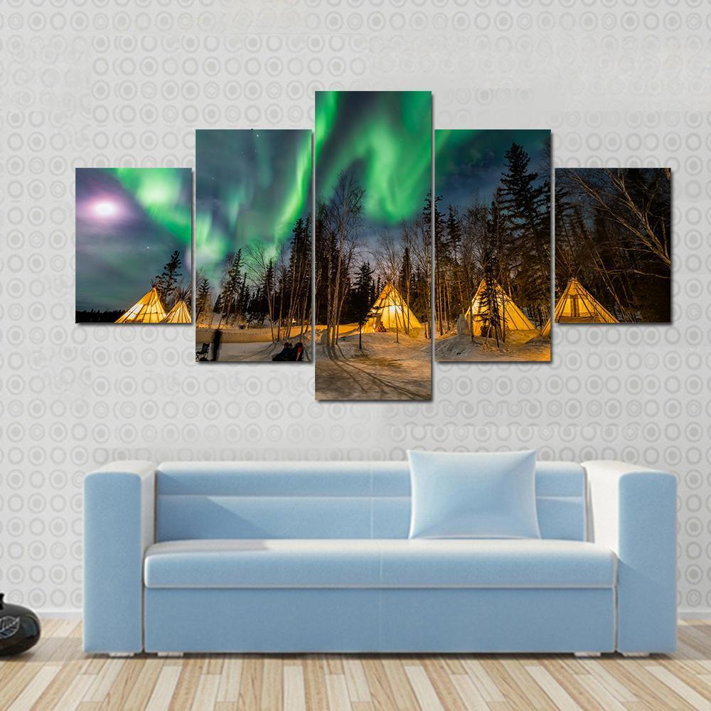 Aurora Village Canvas Wall Art in black, yellow and green, 4 panel Pop layout hung on a wall