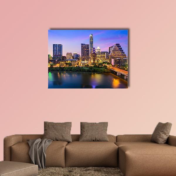 Austin Downtown Night Skyline Canvas Wall Art in yellow, blue and purple, single panel hung on a wall