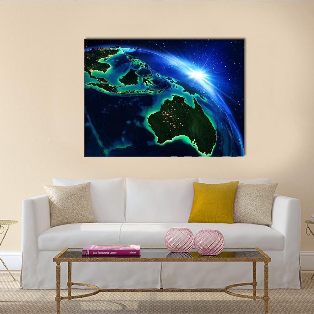 Australia and Indonesia from Space Canvas Wall Art in black, green and blue, single panel hung on a wall