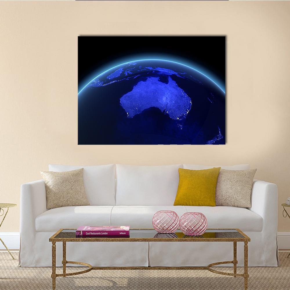 Australia from Space at Night Canvas Wall Art in black and blue, single panel hung on a wall