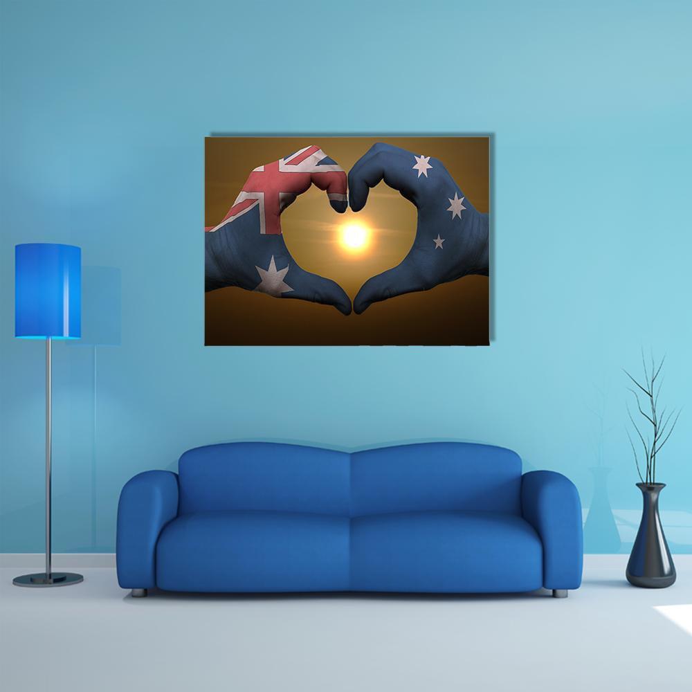 Australian Flag Painted on Hands Canvas Wall Art in brown, red and blue, single panel hung on a wall